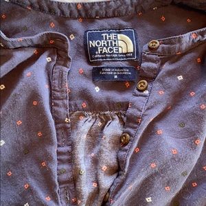 The North Face half button up shirt.